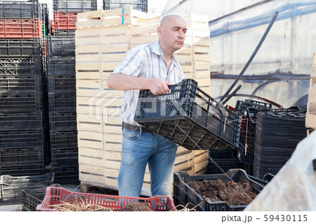 Farmer with organic fertilizer box Farmer with organic fertilizer box 59430115