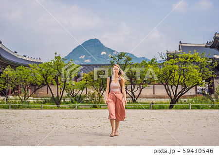 Woman tourist in korea. Gyeongbokgung Palace grounds in Seoul, South Korea. Travel to Korea concept Woman tourist in korea. Gyeongbokgung Palace grounds in Seoul, South Korea. Travel to Korea concept 59430546