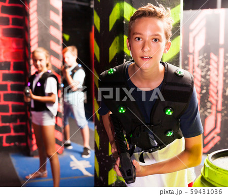 Boy playing laser tag Boy playing laser tag 59431036