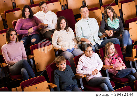People enjoying film screening in cinema People enjoying film screening in cinema 59432144