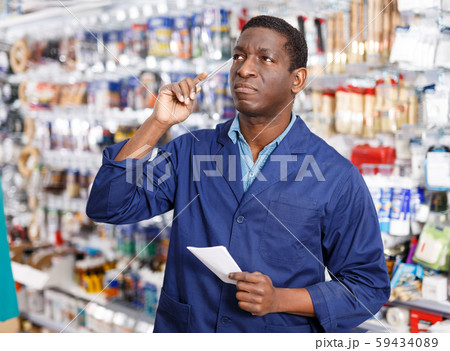 African American worker taking inventory of goods 59434089