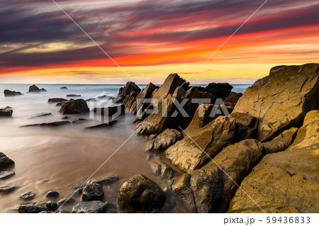 Flysch rocks in Barrika beach at the sunset. Travel in Spain. Flysch rocks in Barrika beach at the sunset. Travel in Spain. 59436833