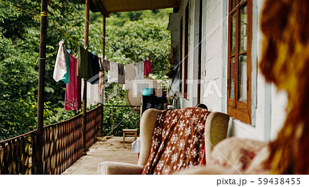 Clothes drying on rope line on a balcony - rural life 59438455