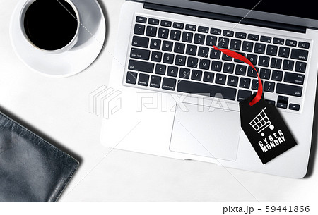 Black label with Cyber Monday text above the laptop on the desk 59441866