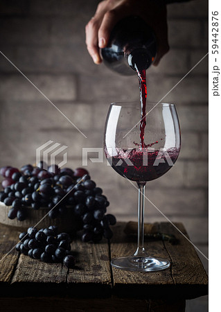 Pouring red wine Pouring red wine 59442876