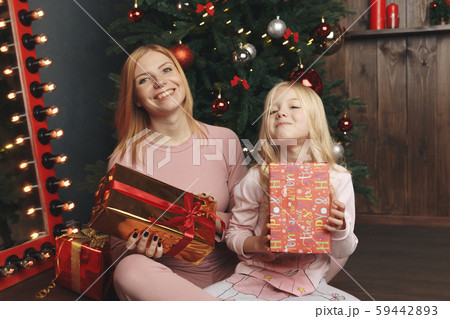 happy family mother and baby little daughter playing in the winter for the Christmas holidays happy family mother and baby little daughter playing in the winter for the Christmas holidays 59442893