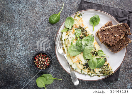 Omelette stuffed with spinach 59443183