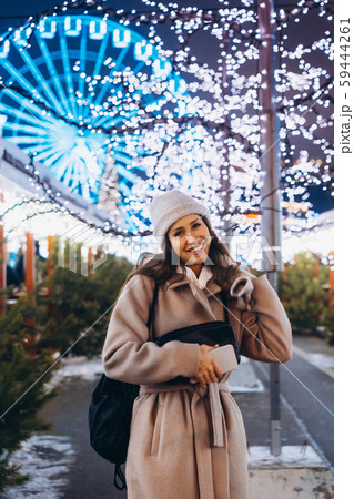 Girl posing against the background of decorated trees Girl posing against the background of decorated trees 59444261