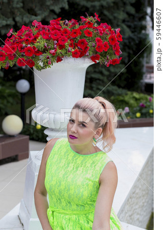 beautiful woman in summer sitting at the flowerpot beautiful woman in summer sitting at the flowerpot 59446607
