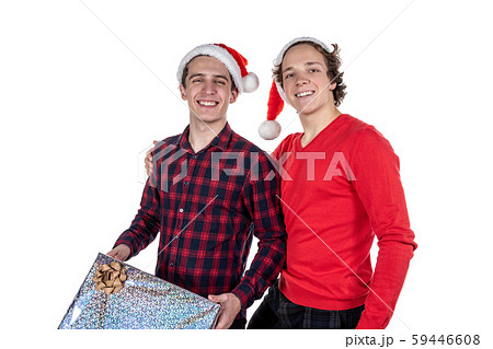 Two funny young men celebrating christmas isolated Two funny young men celebrating christmas isolated 59446608
