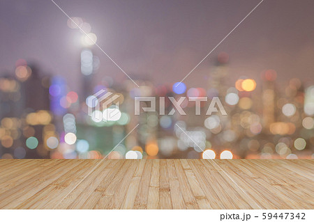Wood floor terrace or wooden table with blur background rooftop perspective view city night light bokeh background of cityscape. 59447342