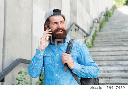 Happiness is traveling. Bearded man speak on 59447429