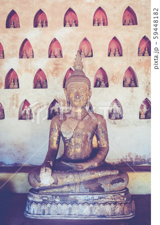 Laos, Old Buddha image in Wat Sisaket popular Laos, Old Buddha image in Wat Sisaket popular 59448182