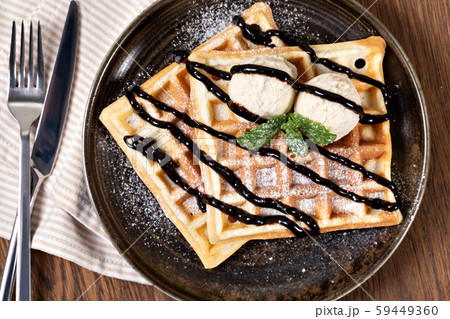 viennese waffles with chocolate syrup 59449360