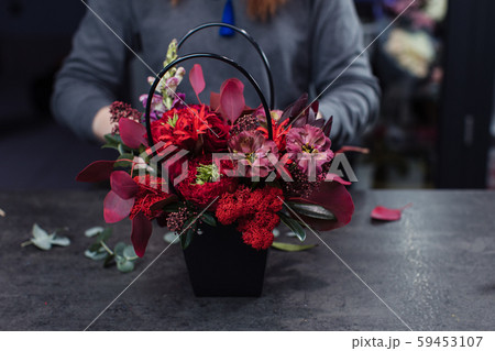 Beautiful bouquet of mixed flowers with peonies. The work of the florist. Flower delivery Beautiful bouquet of mixed flowers with peonies. The work of the florist. Flower delivery 59453107