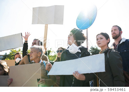 People with placards and posters on global strike for climate change. 59453461