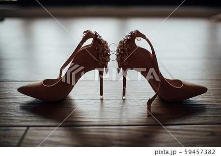 wedding rings on the bride shoes. Wedding. Decor. Bride shoes. 59457382