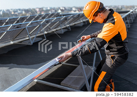 Workman on the solar station 59458382