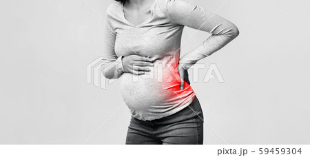 Unrecognizable Pregnant Lady Having Back Pain Standing In Studio, Panorama Unrecognizable Pregnant Lady Having Back Pain Standing In Studio, Panorama 59459304