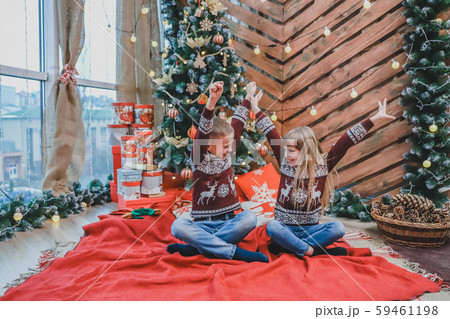 Perfect image where little boy and girl are laughing, raising their hands like winners and having Perfect image where little boy and girl are laughing, raising their hands like winners and having 59461198
