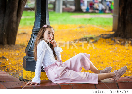 Beautiful young girl sitting at the Paseo Bolivar Square at Cali city center in Colombia Beautiful young girl sitting at the Paseo Bolivar Square at Cali city center in Colombia 59463258