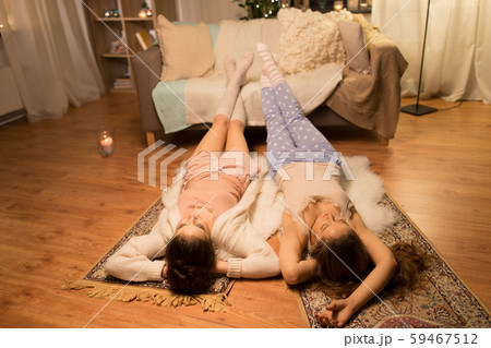 happy female friends at home pajama party 59467512