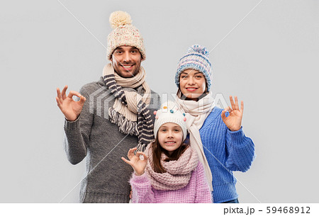 happy family in winter clothes showing ok gesture happy family in winter clothes showing ok gesture 59468912