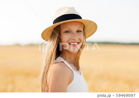 portrait of girl in straw hat on field in summer portrait of girl in straw hat on field in summer 59469097