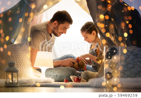 happy family playing with toy in kids tent at home happy family playing with toy in kids tent at home 59469259