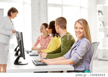 happy high school students in computer class 59469443