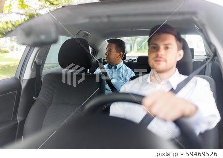 middle aged male passenger and car driver middle aged male passenger and car driver 59469526