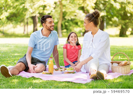 happy family having picnic at summer park 59469570