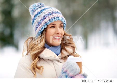 happy woman drinking coffee outdoors in winter happy woman drinking coffee outdoors in winter 59470361