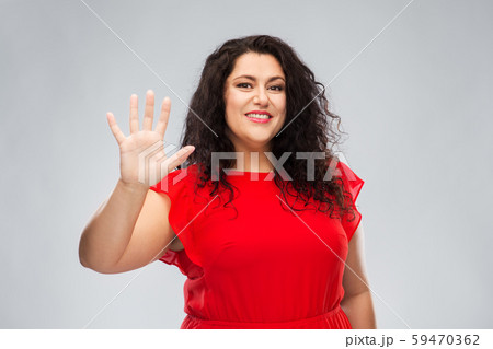 happy woman in red dress showing five fingers happy woman in red dress showing five fingers 59470362