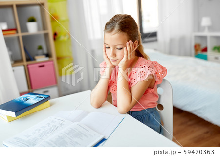 sad student girl with notebook at home 59470363