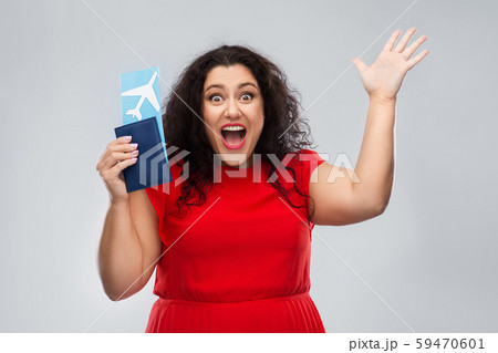 happy woman with passport and air ticket happy woman with passport and air ticket 59470601