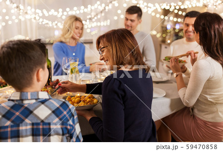 happy family having dinner party at home 59470858
