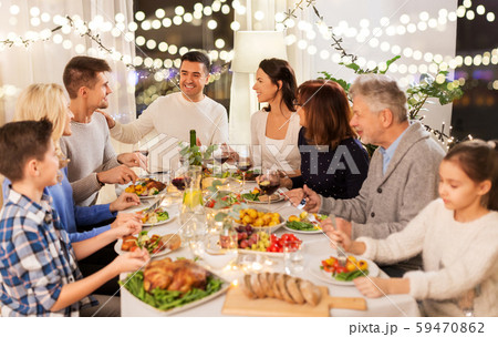 happy family having dinner party at home 59470862