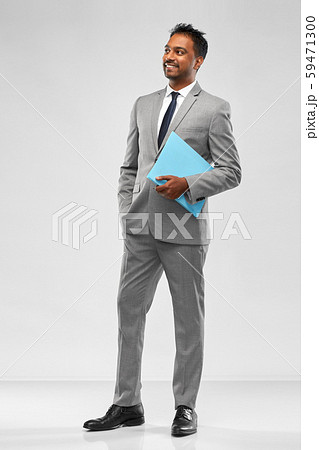 indian businessman with folder over grey indian businessman with folder over grey 59471300