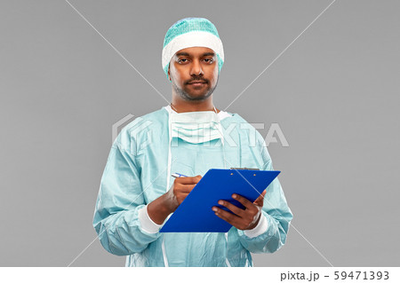 indian male doctor or surgeon with clipboard 59471393