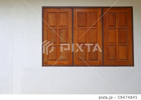wooden window closed on white wall residential house 59474845