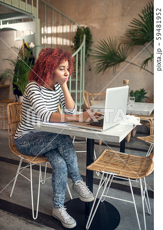 Young cute businesswoman reading e-mail from investor Young cute businesswoman reading e-mail from investor 59481952