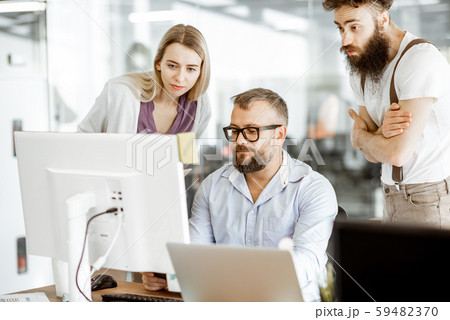 Manager with office workers in the office Manager with office workers in the office 59482370
