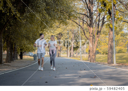 Couples are exercising in the park. Couples are exercising in the park. 59482405