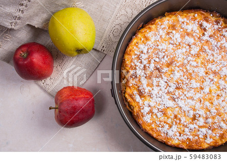 Apple pie with fresh fruits on light marble 59483083