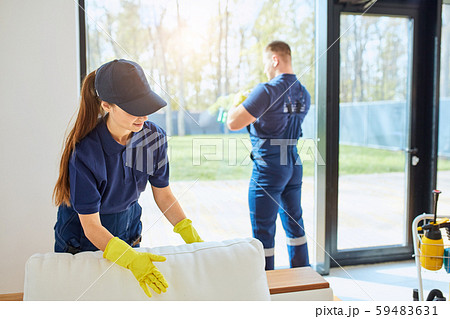 Man and woman do spring-cleaning in new house Man and woman do spring-cleaning in new house 59483631