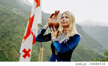 Young beautiful blonde in national georgian clothes 59484516