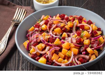 Potato and beetroot salad with olive oil dressing, vegetarian cuisine. 59486982