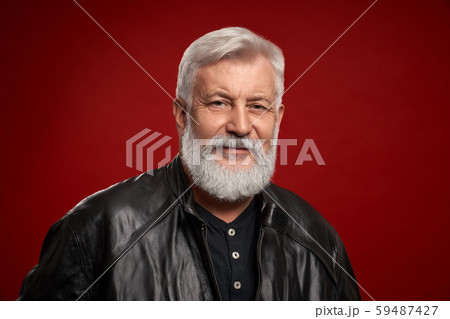 Portrait of confident aged man in black leather jacket 59487427