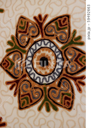 Handmade decoration on fabric. 59492663